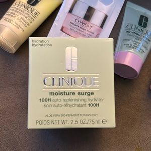 Clinique moisture surge 2.5 oz…with bag and other goodies pictured.  100 new!
